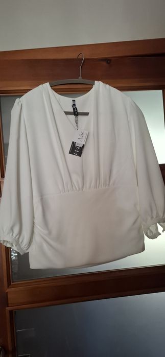 Bluzka w kolorze śmietankowym r. 42 elegancka
