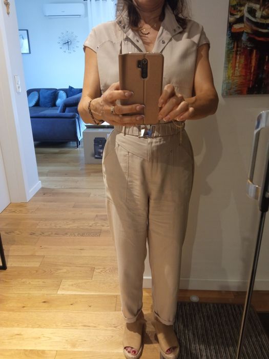 Kombinezon w kolorze beżu rozm. M/L