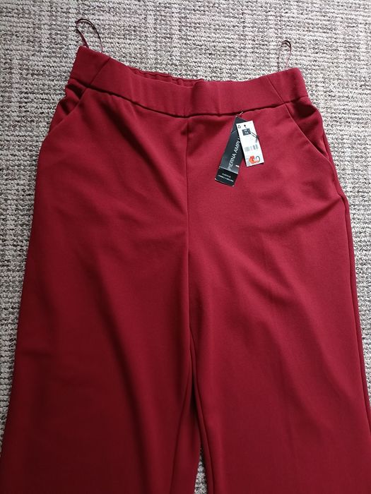 Materiałowe spodnie z szeroką nogawka