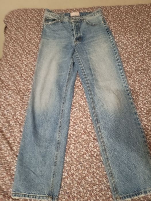 Spodnie szersze na guziki z wysokim stanem