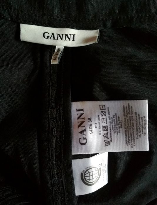 Czarne eleganckie prześwitujące spodnie Ganni koronkowe koronka kwiaty