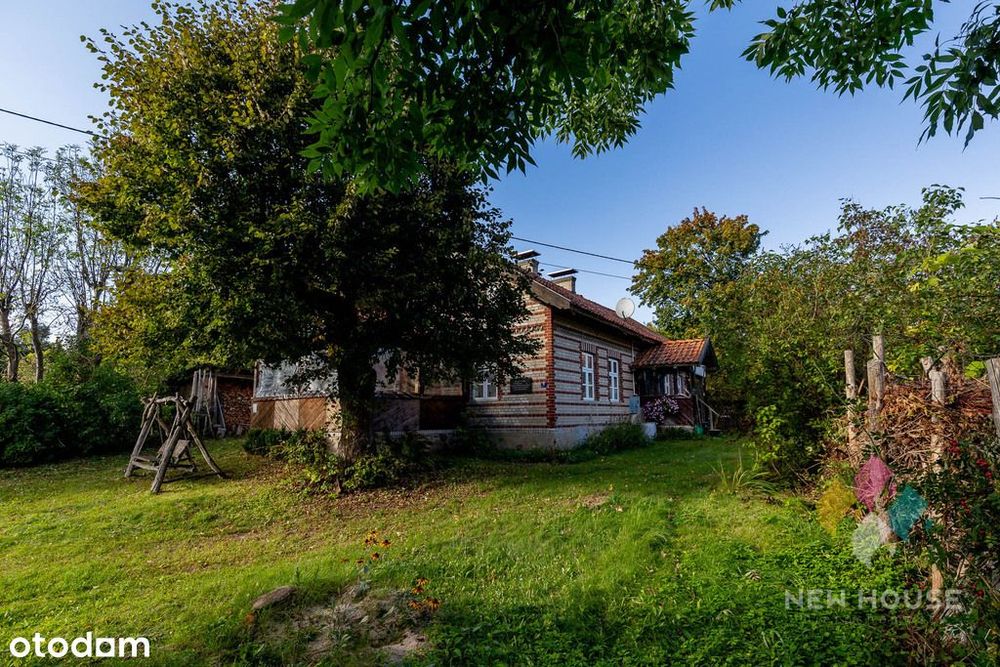 Dom wolnostojący w stylu warmińskim, las, jezioro