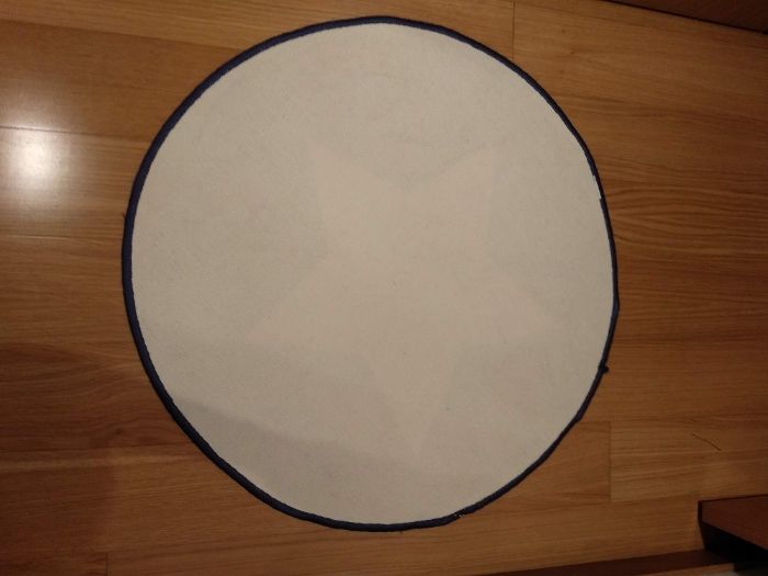 Tapete e almofada redondos azul estrela