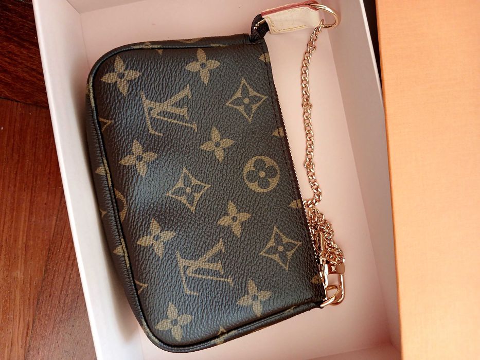Pochette Louis Vuitton autêntica com talão de compra