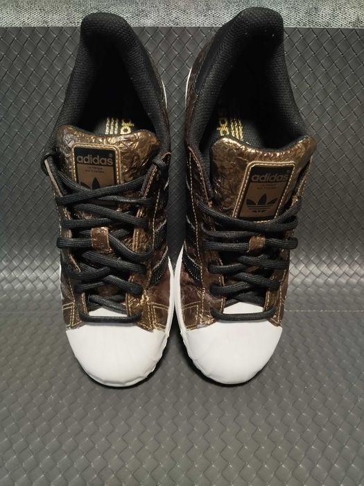 Adidas Superstar metallic foil gold.