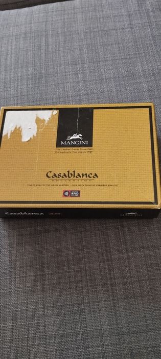 Carteira porta moedas unisexo em pele.