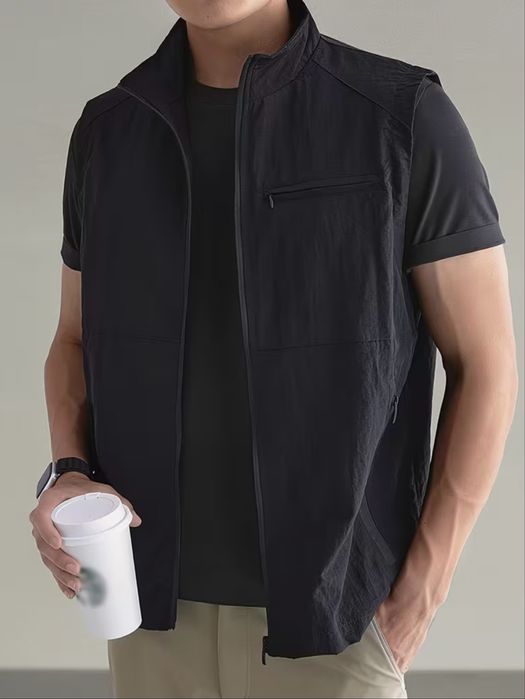 Жилетка чорна нова