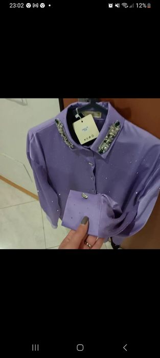 Conjunto de blusa e   saia  de calção