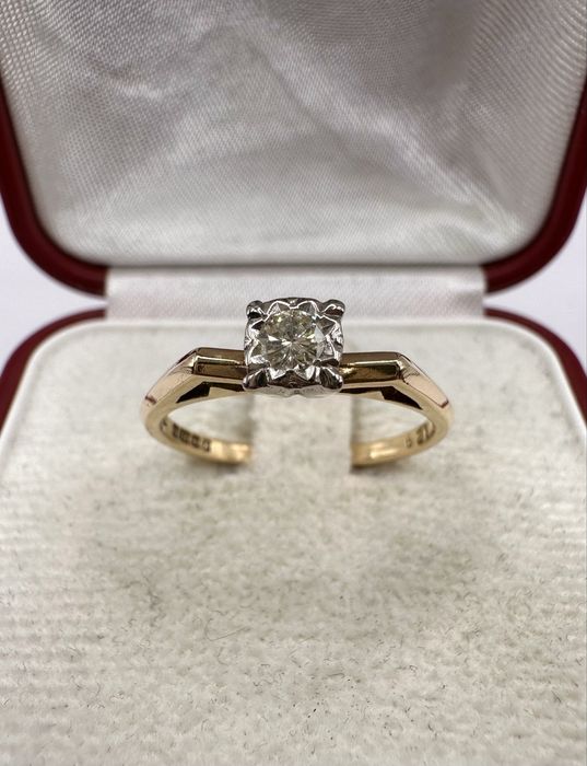 Złoty pierścionek 750 z diamentem 0,13ct