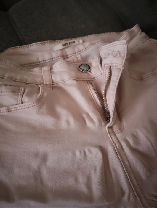 Spodnie z dziurami szarpane nogawki brudny pudrowy róż Pink Kiss S