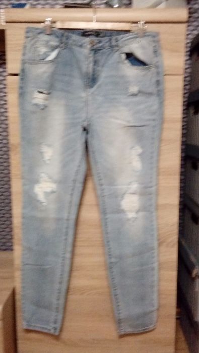 Jeansy jasne z dziurami rozmiar XL