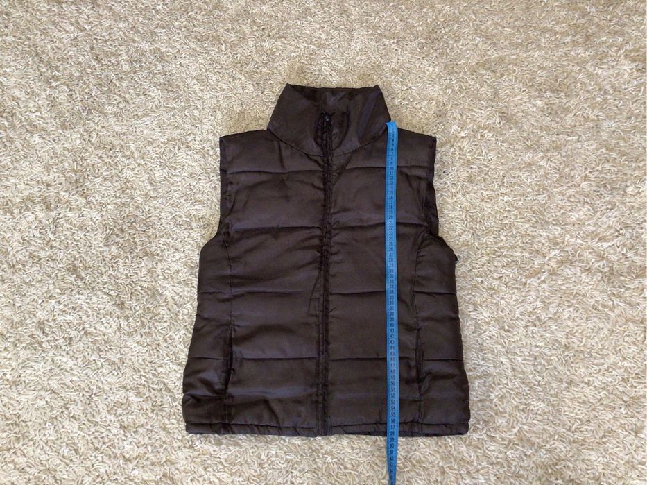 Жилетка теплая.