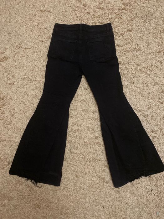 Джинсы клеш рваные