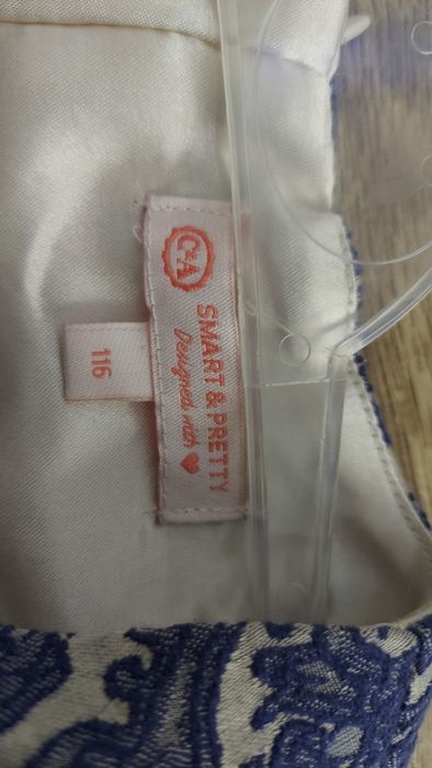 Elegancka  sukienka  z niebieskim żakadrowym wzorem C&A rozm.116