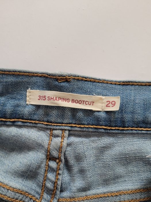 Jasne jeansy spodnie bootcut levis średni stan dzwony M 38
