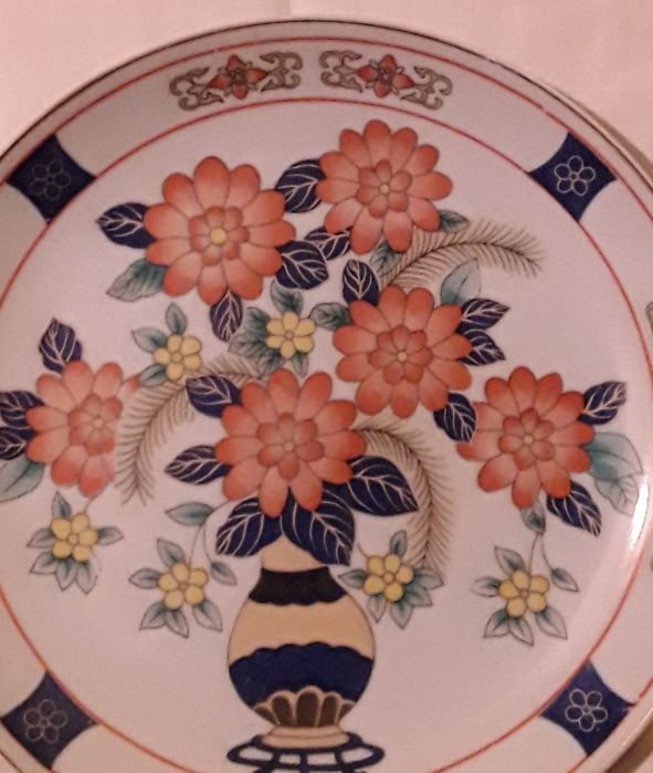 Prato decorativo com flores laranjas com 22 cm