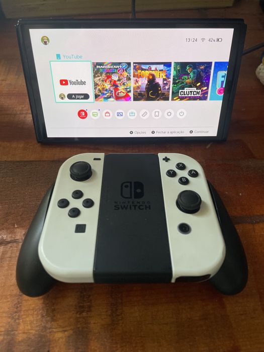 Nintendo switch oled com jogos e todos os acessorios tudo com novo
