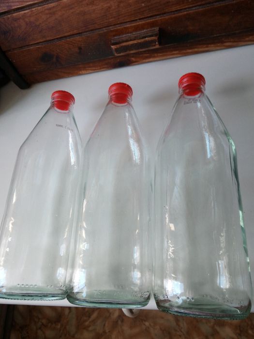 57. Butelki po occie 22 sztuki