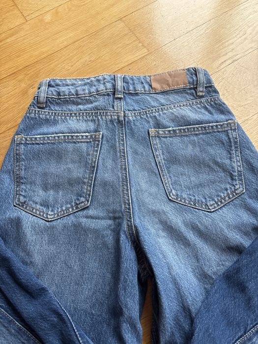 Szerokie jeansy marki MNG