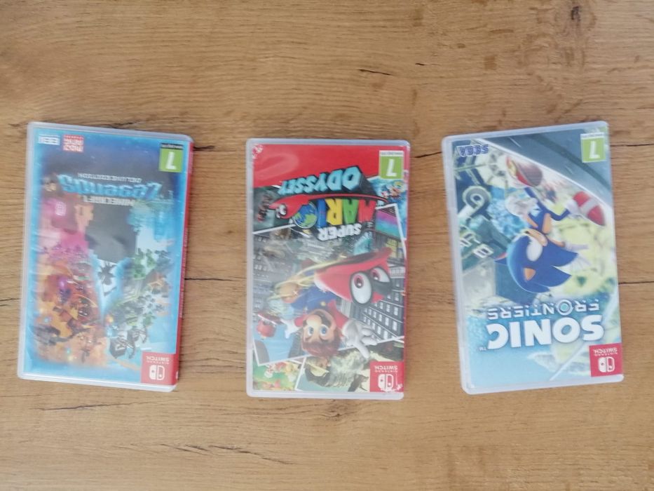 Nintendo Switch OLED + 4 gry