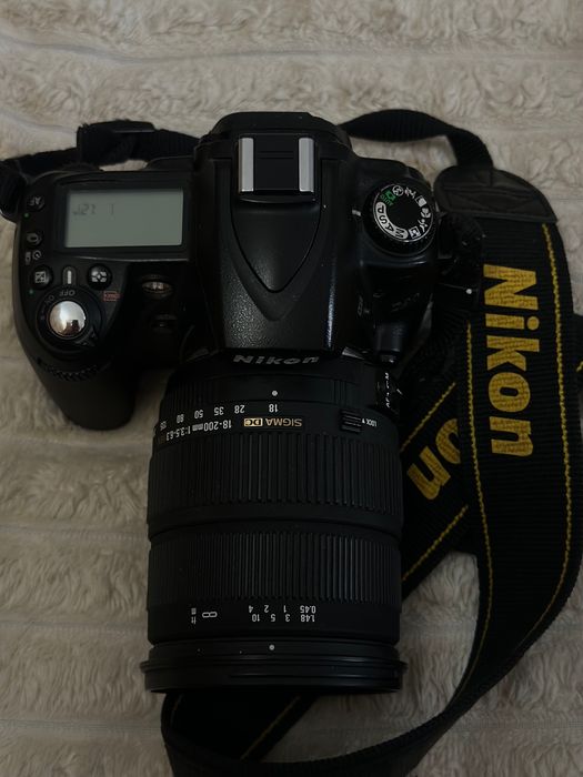 Nikon D90 + Sigma 18–200 + adapter do telefonu