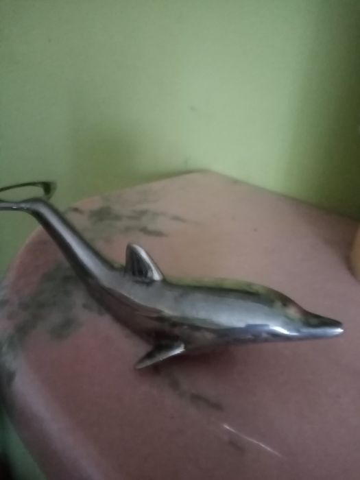 Stary otwieracz do butelek. Podwójny. Delfin