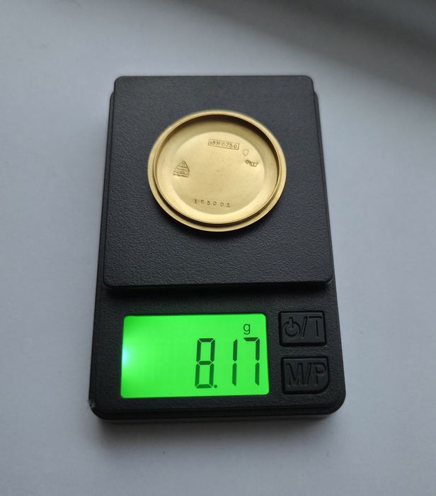 Золотий швейцарскій годинник Omega