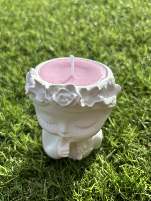 boneca de gesso cerâmico com vela