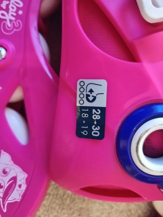 Patins em linha rosa/roxo