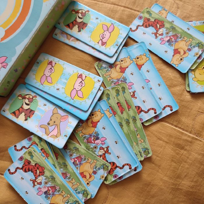 Domino Kubuś i przyjaciele oraz książka Puchatek hoduje dynię Egmont