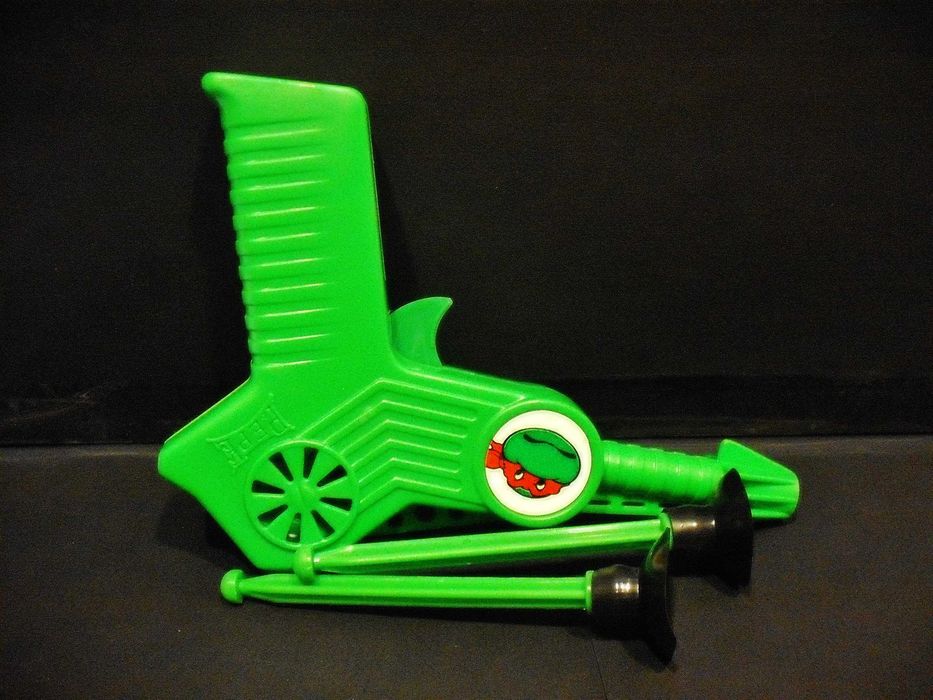 Pistola com dardos da tartaruga Ninja PEPE antiga