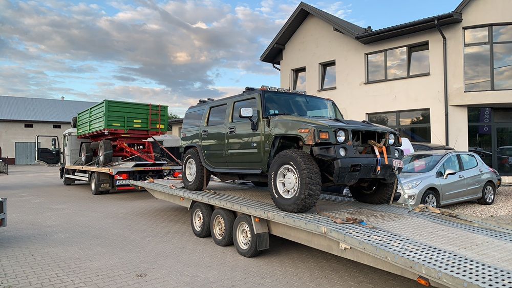 Holowanie AutoLaweta Transport Samochodów Ciągników Maszyn RolniczychWypożyczalnia Busów Przyczep Towarowych i Do Koni Pomoc Drogowa Auto Komis
