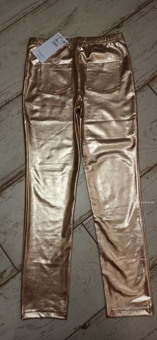 Nowe tregginsy spodnie złote wizytowe 140