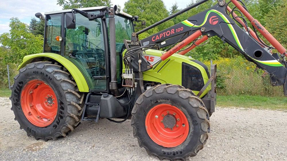 Claas Axos 320 z ładowaczem czołowym Faucheux Captor 100