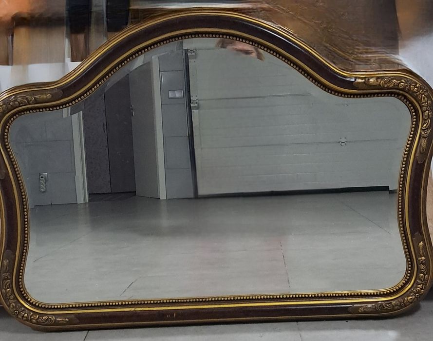Versatile mirror. In good condition, brown with a golden touch enve