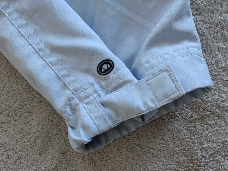 Niebieskie spodnie sportowe dresowe ortalionowe dresy Ellesse 38