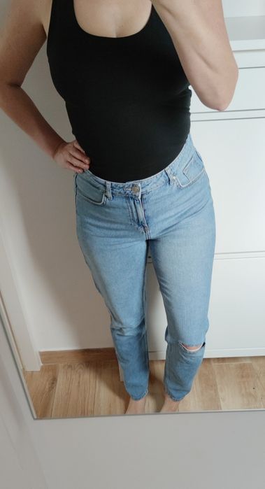 Jasnoniebieskie spodnie jeansowe jeans Never Denim rozmiar M/38