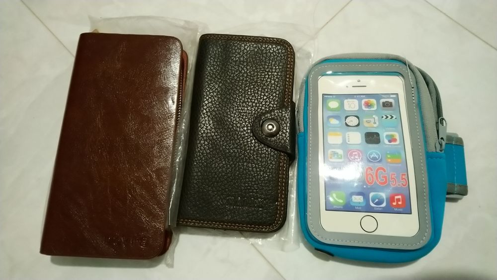 Гаманці кошельки для денег и тел.