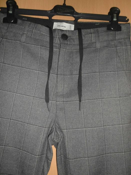calças para homem da marca PULL&BEAR como novas