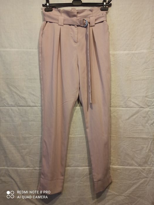 Spodnie damskie w kolorze pudrowego różu. Roz. 12