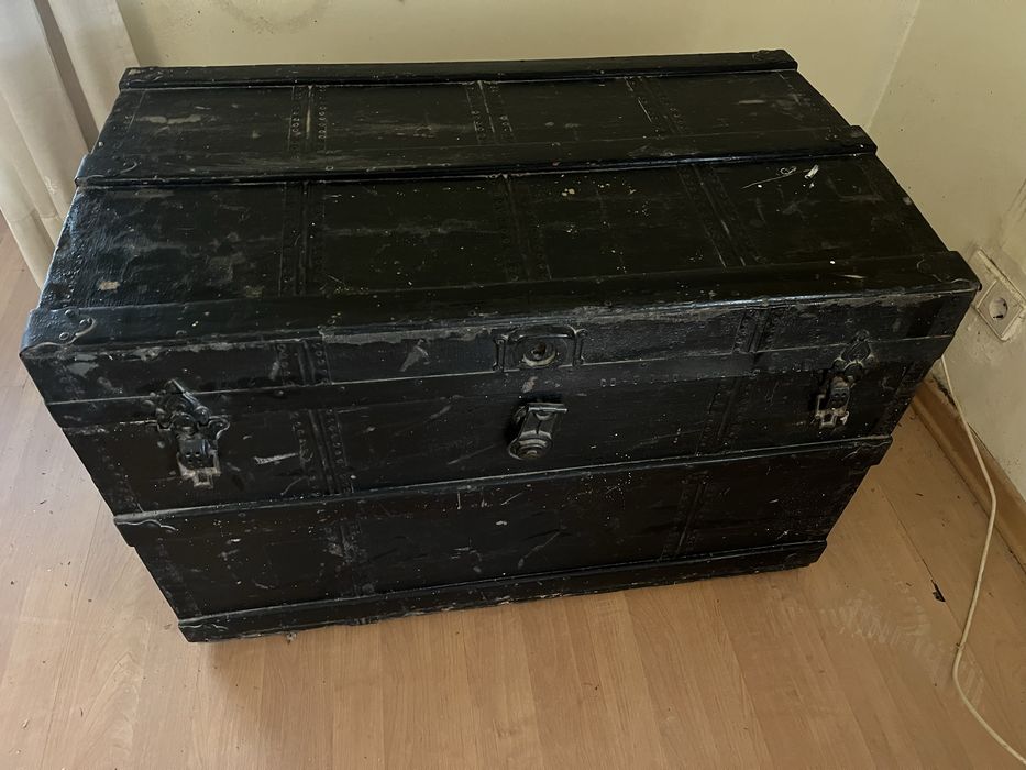 Vintage chest upholstered in black leather