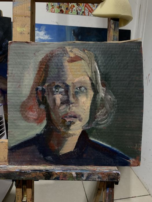 Pintura de autor:face com cabelo vemelho à esquerda