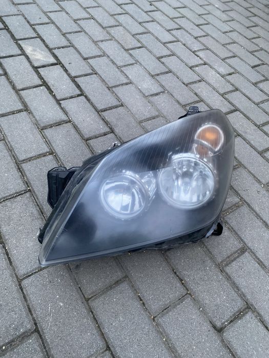 Reflektor lewy przód opel astra H 24451032LH