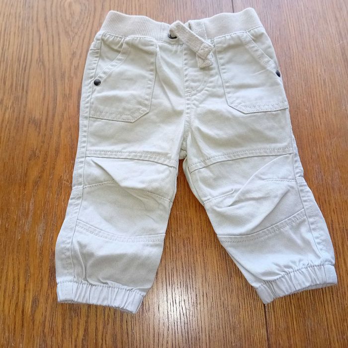 UNISEKS - sliczne spodnie jasny krem rozmiar -62/68cm