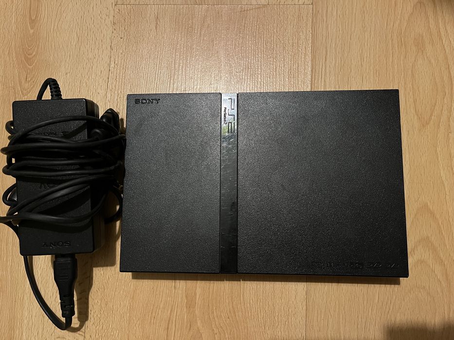 PS2 with controllers, games, and microphone for SingStar Latino64172206791810121