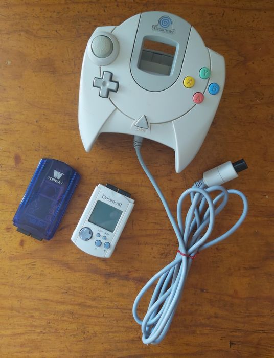 Dreamcast controller + VMU and controller vibration pack.64738122461569120