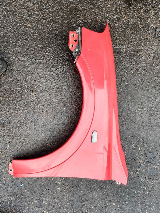 Opel Astra II G błotnik lewy czerwony