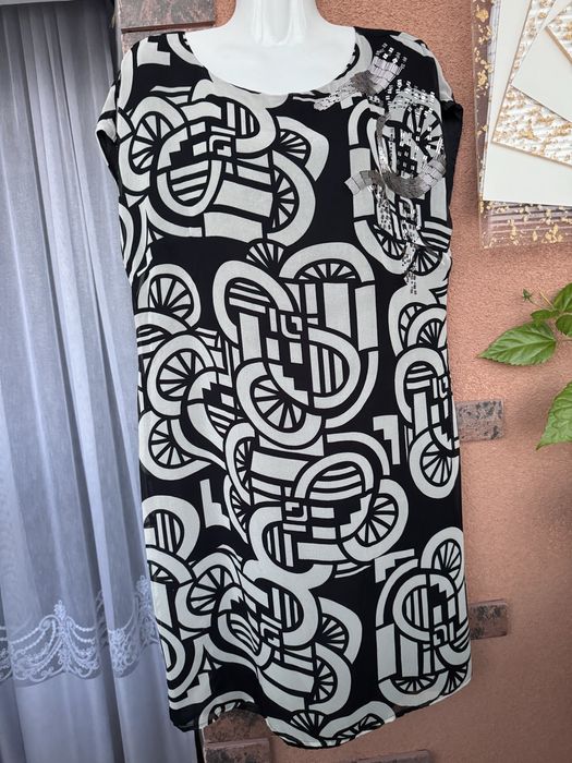 Платья Туники свитера худи