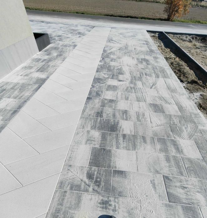 Układanie kostki brukowej i montaż ogrodzeń