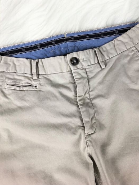 Kremowe chlopiece eleganckie spodnie chinosy Massimo Dutti